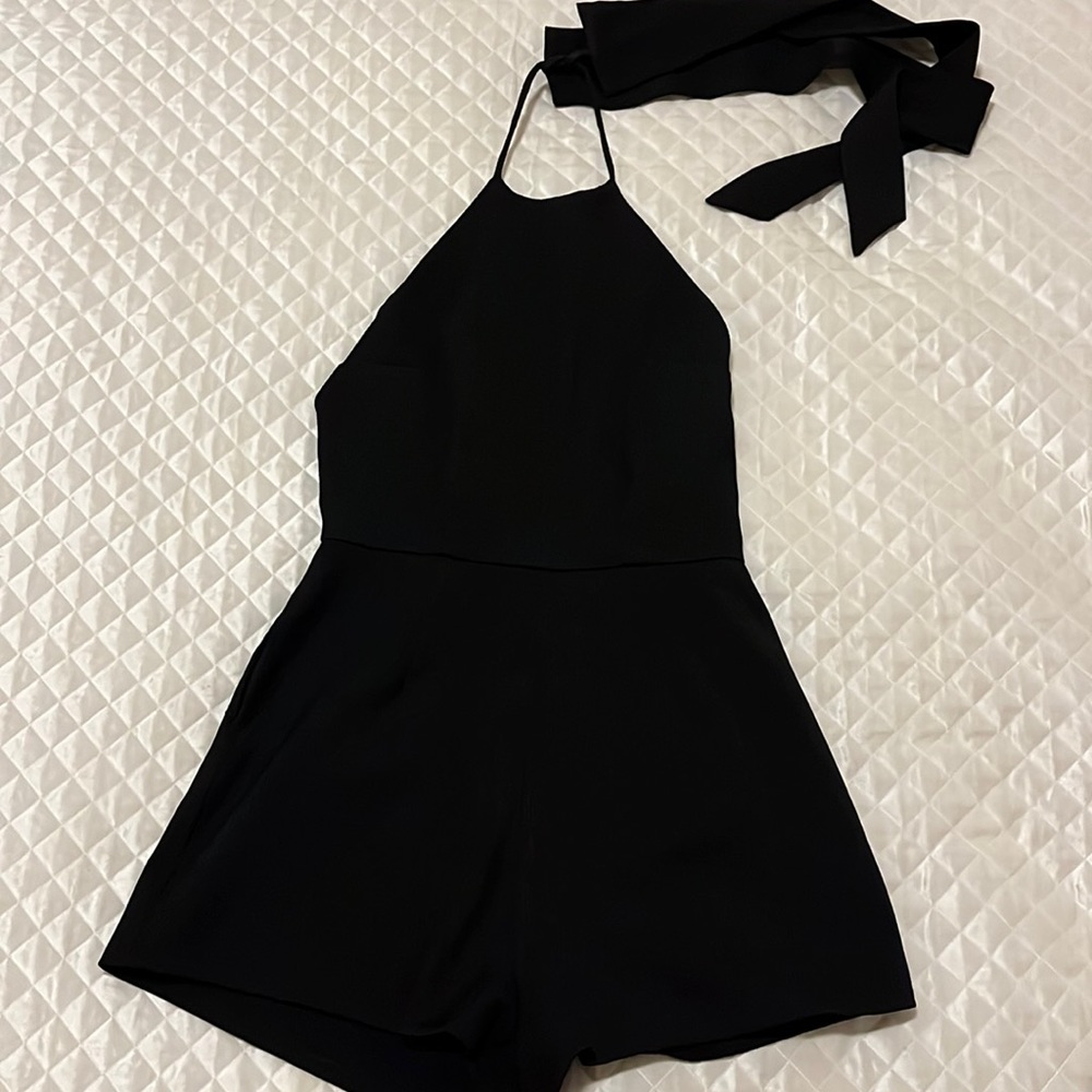 Black Romper with open back and tie around the neck